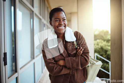 Image of University, education student and black woman with arms crossed in campus ready for learning, studying or knowledge. College, scholarship and happy female thinking or contemplating goals or targets.