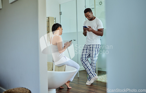 Image of Social media, app and black couple on phone in the bathroom for news, website and chat. Communication, happy and African man and woman reading funny story on the internet on a mobile in the morning