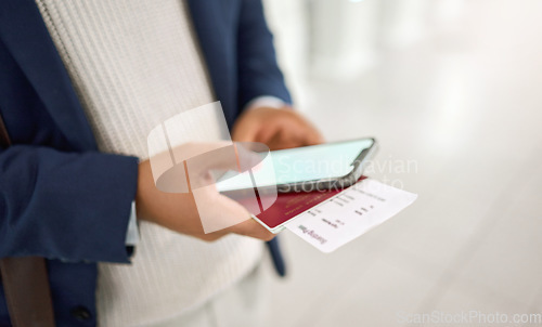 Image of Hands, phone and passport chatting, typing or texting on mobile app or checking flight times at the airport. Hand of business employee holding smartphone and ID documents for travel, trip or journey