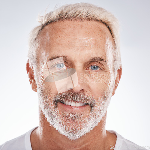 Image of Face portrait, skincare and senior man in studio on a gray background. Wellness, cosmetics and retired, elderly and happy male model with healthy skin after spa treatment for beauty and grooming.