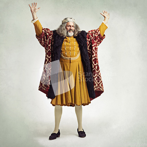 Image of Royal king man, studio and hands in air for power, magic or winning celebration by gray background. Ancient medieval leader, portrait and full body with fantasy, happiness or vintage robe by backdrop