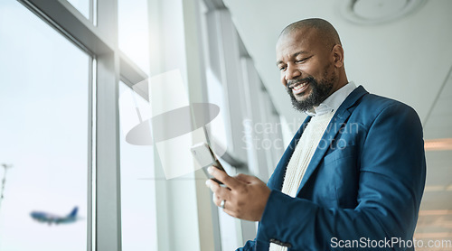 Image of Email, travel and black man with a phone at the airport for connection, communication and work update. Happy, executive and African businessman reading information on a mobile while on a trip