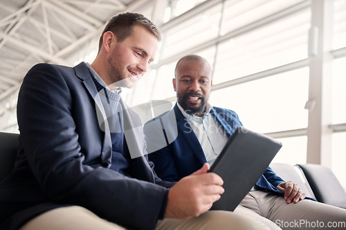 Image of Business people, tablet and waiting at airport for schedule, travel or work trip journey together. Employee workers holding touchscreen for meeting, communication or planning for traveling or flight