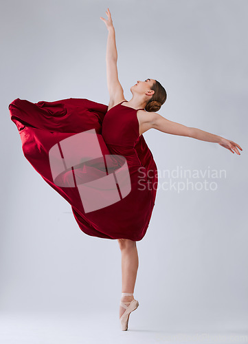 Image of Ballet, dance and woman training for performance, wellness and hobby on grey studio background. Ballerina, creative dancer and female young person practice, routine and artist dancing, talent or free