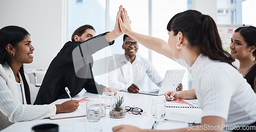 Image of Business meeting, high five and teamwork success for target goals, report management and sales analysis in office. Team, hands celebrate and happiness for corporate achievement or growth motivation
