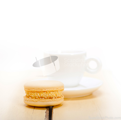 Image of colorful macaroons with espresso coffee