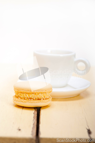 Image of colorful macaroons with espresso coffee