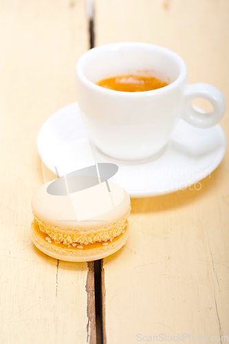 Image of colorful macaroons with espresso coffee