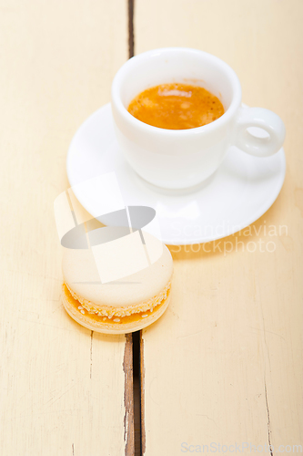 Image of colorful macaroons with espresso coffee