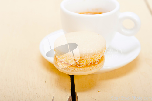 Image of colorful macaroons with espresso coffee