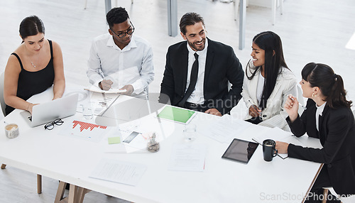 Image of Business people, collaboration meeting and happy talking together in office for planning, sales presentation or financial management. Teamwork, conversation and tech data analysis for target goals