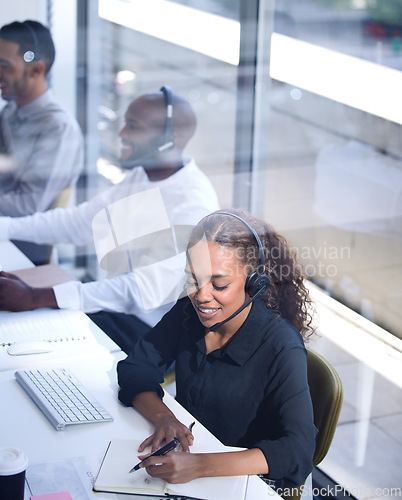 Image of Call center, customer support with a happy black woman consultant working in her telemarketing office. Contact us, crm and communication with a female consulting using a headset from above