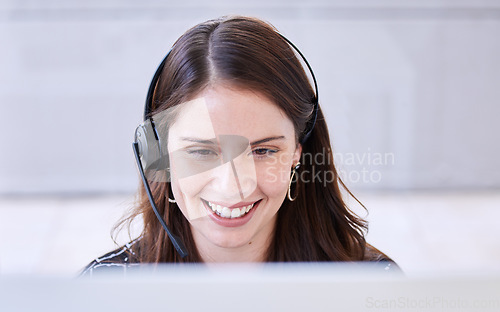 Image of Woman, call center and smile with computer for customer service, advice and conversation while reading screen. Crm expert, consulting job or telemarketing agent with voip tech, happy and contact us