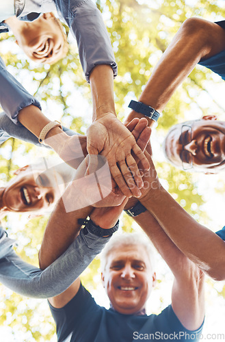 Image of Senior hands, together and support with solidarity outdoor and group diversity with team building in nature. Trust, respect and mission with mature community, hand stack low angle and collaboration.