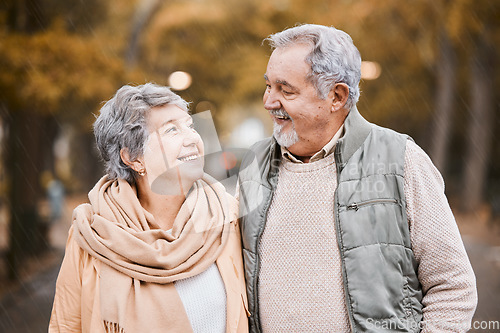 Image of Senior couple, love and health while walking outdoor for exercise, happiness and care at a park in nature for wellness. Old man and woman together in a healthy marriage during retirement with freedom