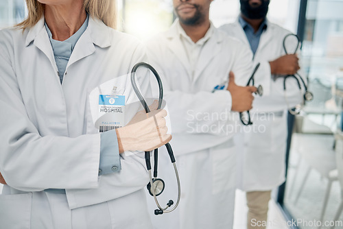 Image of Healthcare, team and hands of doctors with stethoscope for trust, support and insurance in hospital. Teamwork, leadership and group of medical workers with tools for medicine, wellness and cardiology