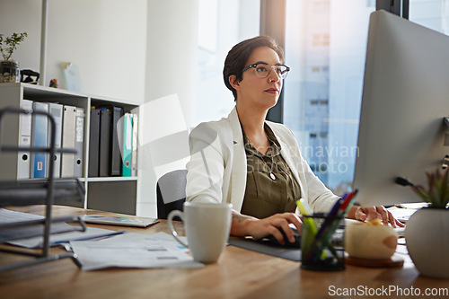 Image of Reception, computer and business woman in office typing online documents, website research and writing email. Corporate, networking and busy female employee at desk with focus, planning and ideas