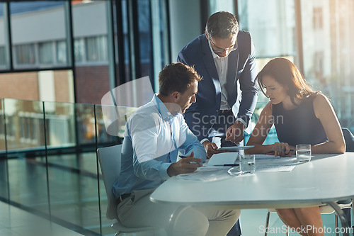 Image of Men, woman and tablet at business meeting in office planning, goals or mission at desk with strategy. Teamwork, touchscreen or leadership for vision, collaboration and coaching in financial company