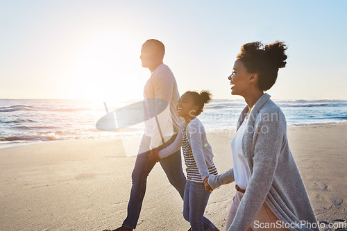 Image of Black family, sunset and walking on the beach by happy child and parents on vacation or holiday. Sea, ocean and travel with African daughter or kid holding hands together near water