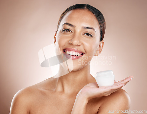 Image of Woman portrait, face skincare or cream container on studio background in dermatology, chemical peel or acne treatment. Smile, happy or beauty model with facial sunscreen product for Brazil healthcare