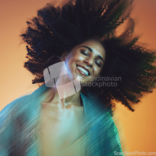 Image of Hair movement, beauty and face of black woman with afro in studio for hair care, beauty products and wellness. Creative art, hair salon and happy female with motion for cosmetics, fashion and makeup