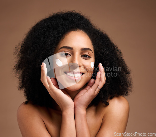 Image of Skincare, sunscreen and black woman in portrait for facial, beauty and cosmetics promotion of product in studio. Happy African model with skin care, dermatology and cream, hands and face for wellness