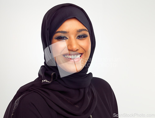 Image of Portrait, islamic and beauty with a woman in studio on a gray background for holy religion or belief in god. Face, skincare and makeup with a muslim female model wearing a traditional hijab