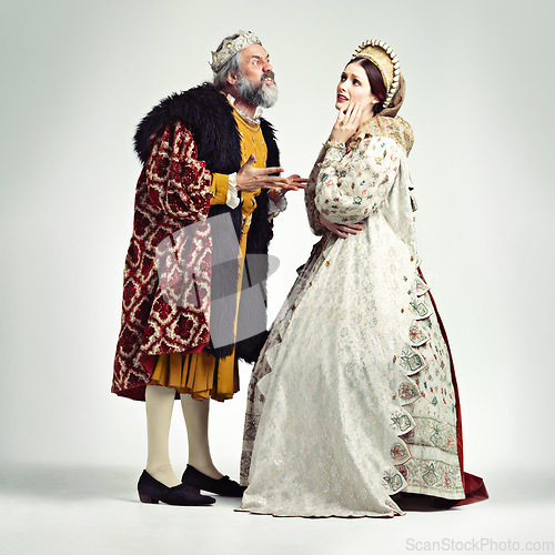 Image of Anger, medieval and king with queen on a white background for argument, frustrated and fighting. History, theatre and royal couple in vintage, renaissance and Victorian cosplay isolated in studio