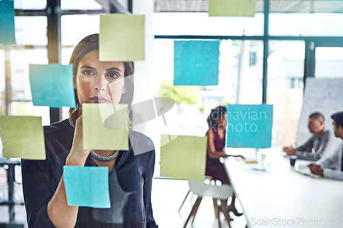 Image of Thinking, planning or business woman for schedule idea, creative or marketing review in meeting. Corporate, post it or manager on glass for data analysis, strategy or project management