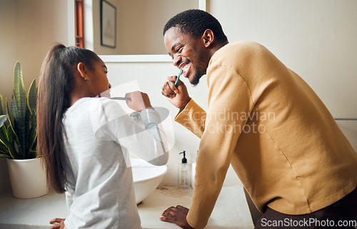 Image of Oral care, brushing teeth and father with daughter in bathroom for hygiene, grooming and bonding. Dental health, girl and black people cleaning while having fun, playful and smile in their home
