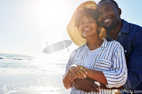 Image of Beach hug, smile and black couple relax, travel and enjoy outdoor quality time together on Jamaica holiday mockup. Ocean sea water, blue sky flare and freedom peace mock up for happy bonding people