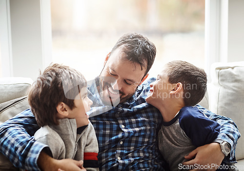 Image of Family home, boys and dad with hug on sofa for conversation, love or bonding for childhood development. Happy people, relax or joke together in living room for fun, happiness or quality time in house