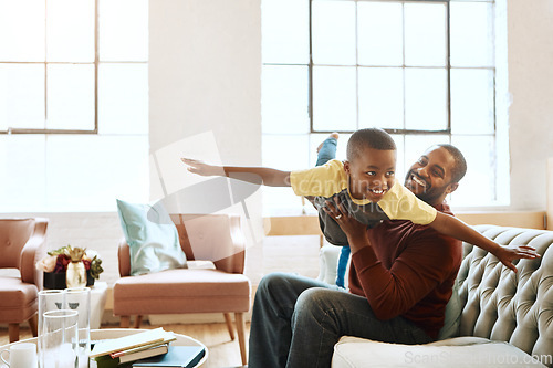 Image of Airplane, game and father with son on a sofa, playing and bonding in their home together. Love, family and parent enjoy relationship with smiling boy, fly and fun in the living room on the weekend