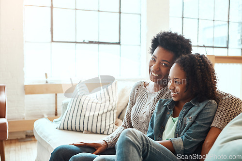 Image of Love, mother and teen girl on sofa for happy family time together in apartment in South Africa on weekend. Smile trust and support, black woman and teenager sitting on couch with healthy relationship