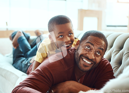 Image of Happy family, father and son on sofa, relax and play, happy and smile while bond in their home. Love, parent and child excited, playful and cheerful In a living room, joy and enjoy weekend together