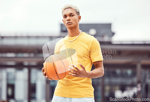 Image of Basketball, young man and basketball player with sport in park with portrait in city and exercise outdoor. Fitness, athlete on basketball court, focus and urban with sports motivation and training.