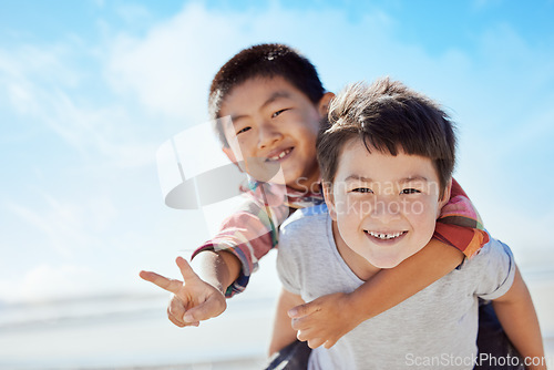 Image of Beach, peace sign and Asian children hug on Japan travel vacation for calm, freedom and outdoor nature. Blue sky, ocean sea or happy youth portrait of fun kids or friends on holiday playing piggyback