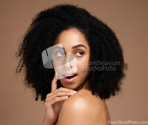 Image of Face, beauty skincare and thinking black woman in studio isolated on a brown background. Makeup, cosmetics and surprised or shocked young female model with idea for spa facial treatment and wellness.