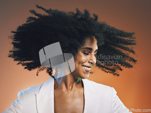 Image of Natural hair, beauty and black woman with hair care, cosmetics and happiness against studio background. Makeup, dance and freedom with pride in curly hair texture and wellness in skincare headshot