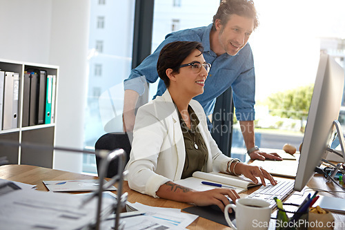 Image of Corporate, man and woman with computer, talking and online reading for strategy, marketing and modern office. Manager, coworkers or female employee with digital advertising, explain system or process