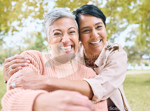 Image of Couple of friends, seniors and portrait hug in nature park, grass garden and relax environment for profile picture. Smile, happy women and bonding retirement elderly in love embrace for social media