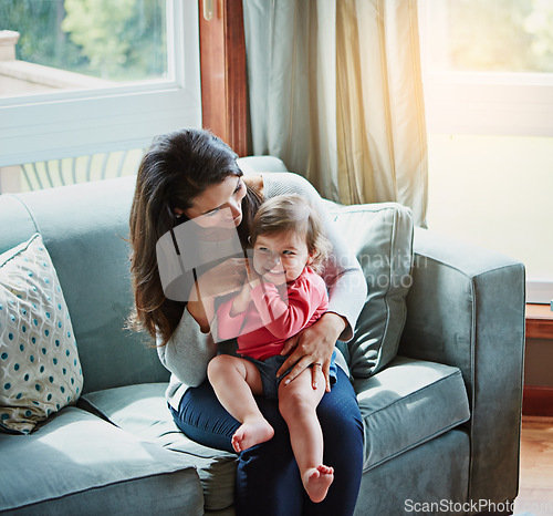 Image of Relax, happy and smile with mother and baby on sofa for bonding, quality time and child development. Growth, support and trust with mom and daughter in family home for health, connection and care