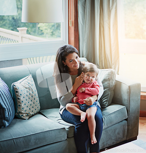 Image of Relax, happy and smile with mother and baby on sofa for bonding, quality time and child development. Growth, support and trust with mom and daughter in family home for health, connection and care