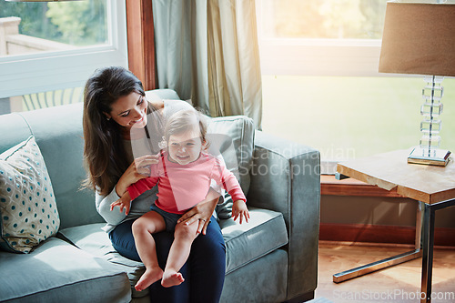 Image of Relax, happy and smile with mother and baby on sofa for bonding, quality time and child development. Growth, support and trust with mom and daughter in family home for health, connection and care