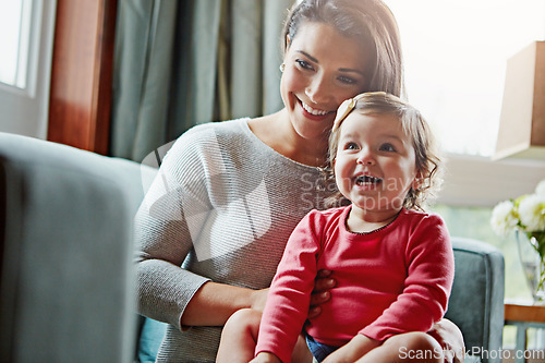 Image of Relax, happy and smile with mother and baby on sofa for bonding, quality time and child development. Growth, support and trust with mom and daughter in family home for health, connection and care