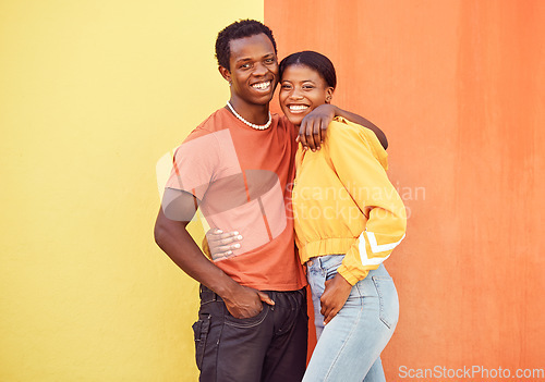 Image of Black couple, youth and fashion with gen z, hug and together with color and portrait against wall background. Black man, black woman and young with trendy streetwear, mockup and marketing in Nigeria.