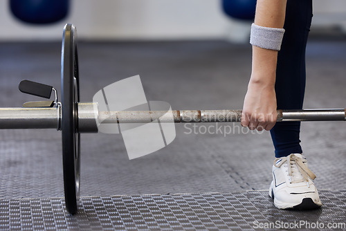 Image of Barbell, woman hands and weightlifting exercise for fitness, workout and sports challenge in gym. Closeup female athlete, body builder and heavy weights for deadlift, wellness and power