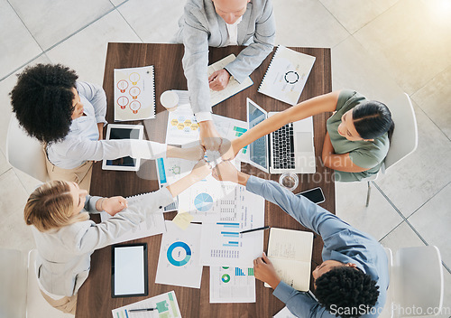 Image of Business people, hands and top view success of team celebration, motivation and support in meeting, trust or collaboration. Diversity workers, hands together and startup goals, vision and partnership