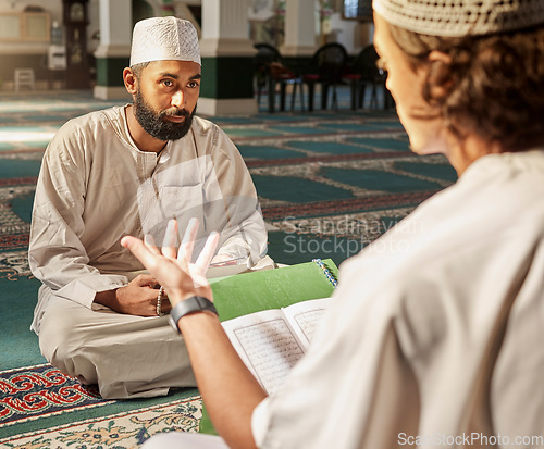 Image of Quran, muslim and mosque with an imam teaching a student about religion, tradition or culture during eid. Islam, book or worship with a religious teacher and islamic male praying together for ramadan