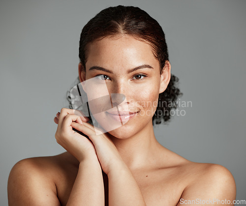 Image of Health, natural and black woman skincare portrait for beauty cosmetic and glow treatment campaign. Healthy body care of model happy with beautiful freckles on face in gray studio background.